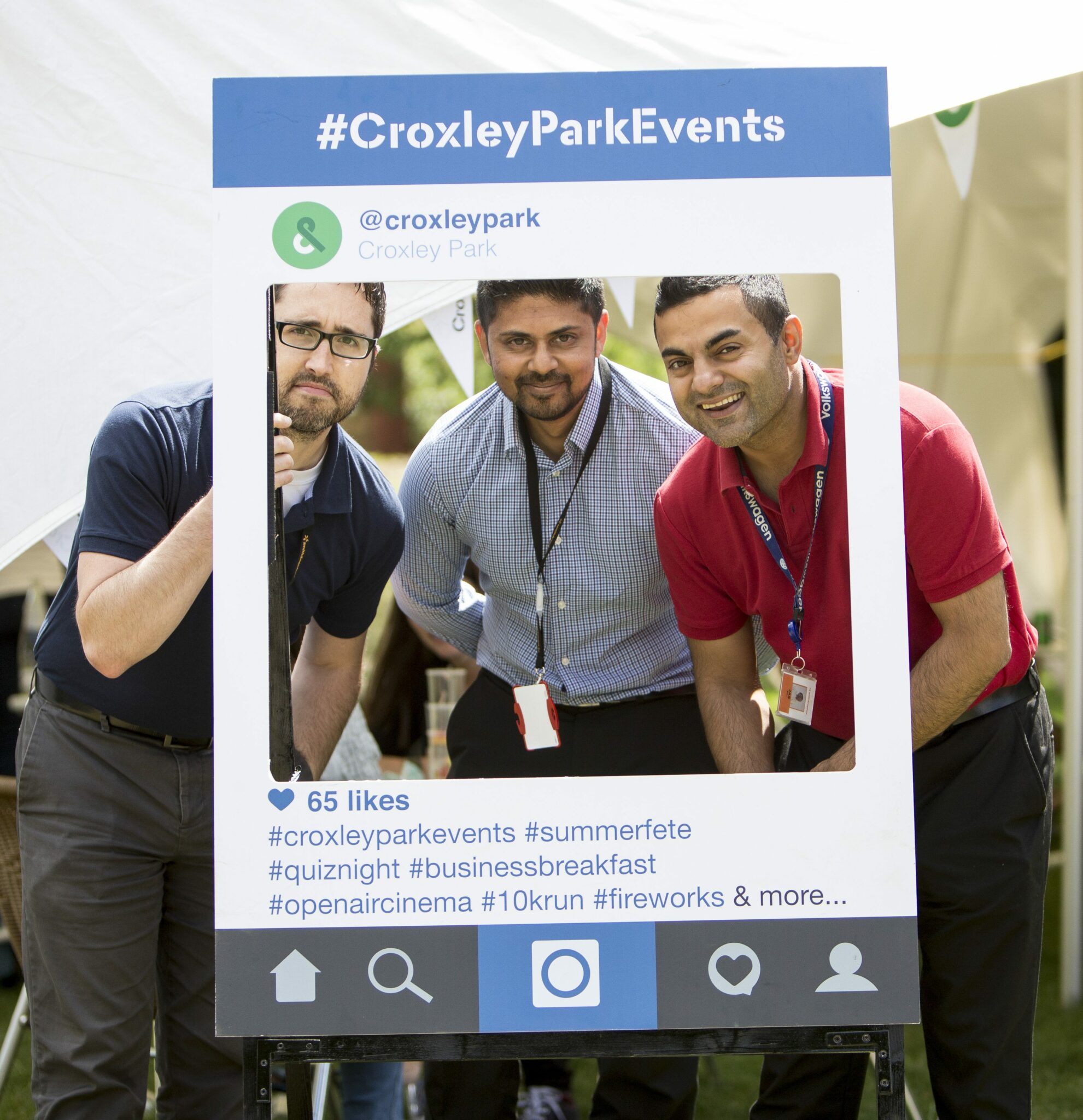 Croxley Park Summer Fete | Colleagues smiling with branded instagram frame